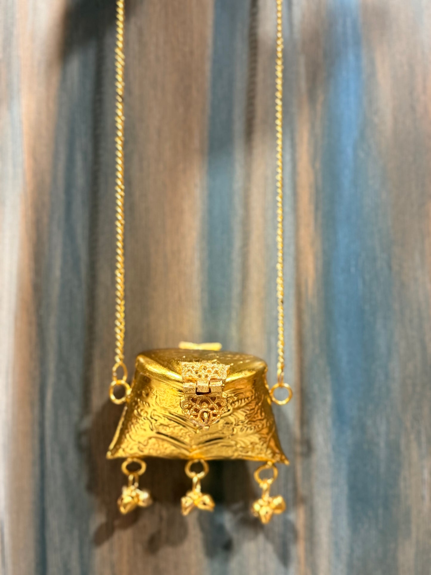Mini brass bag